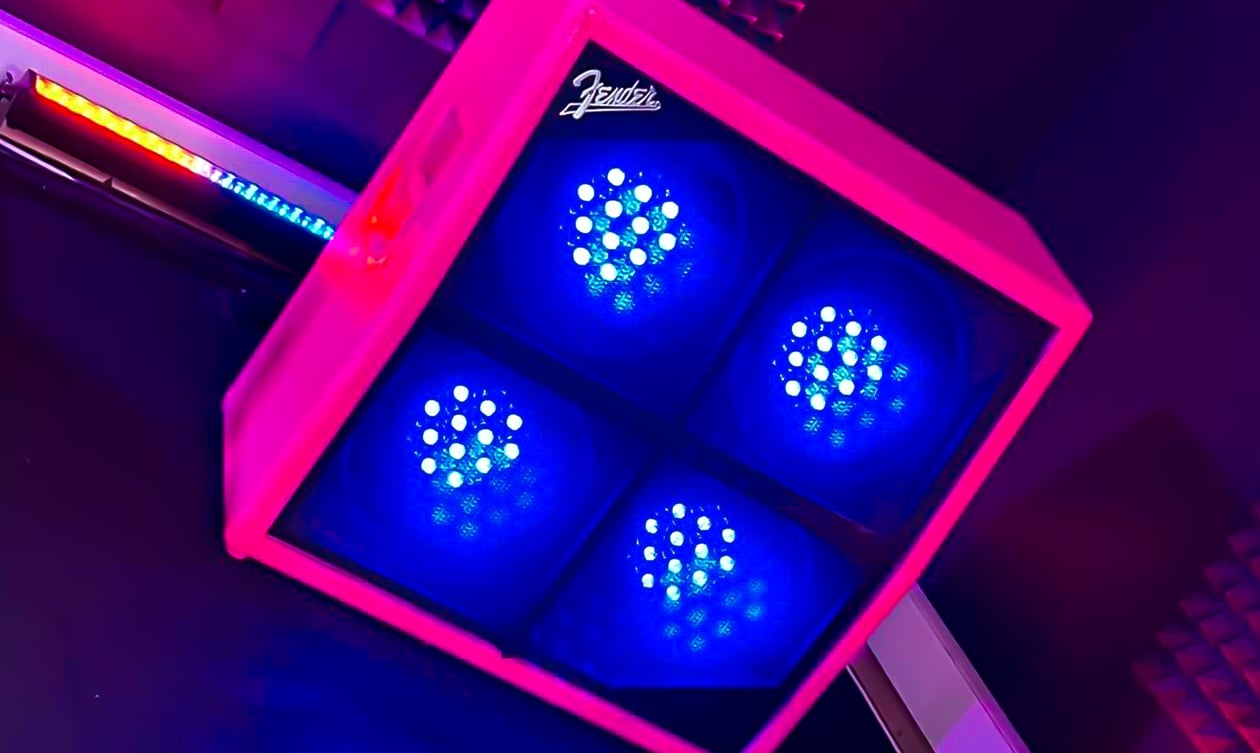 A Fender guitar half stack cab with lights inside of each speaker.